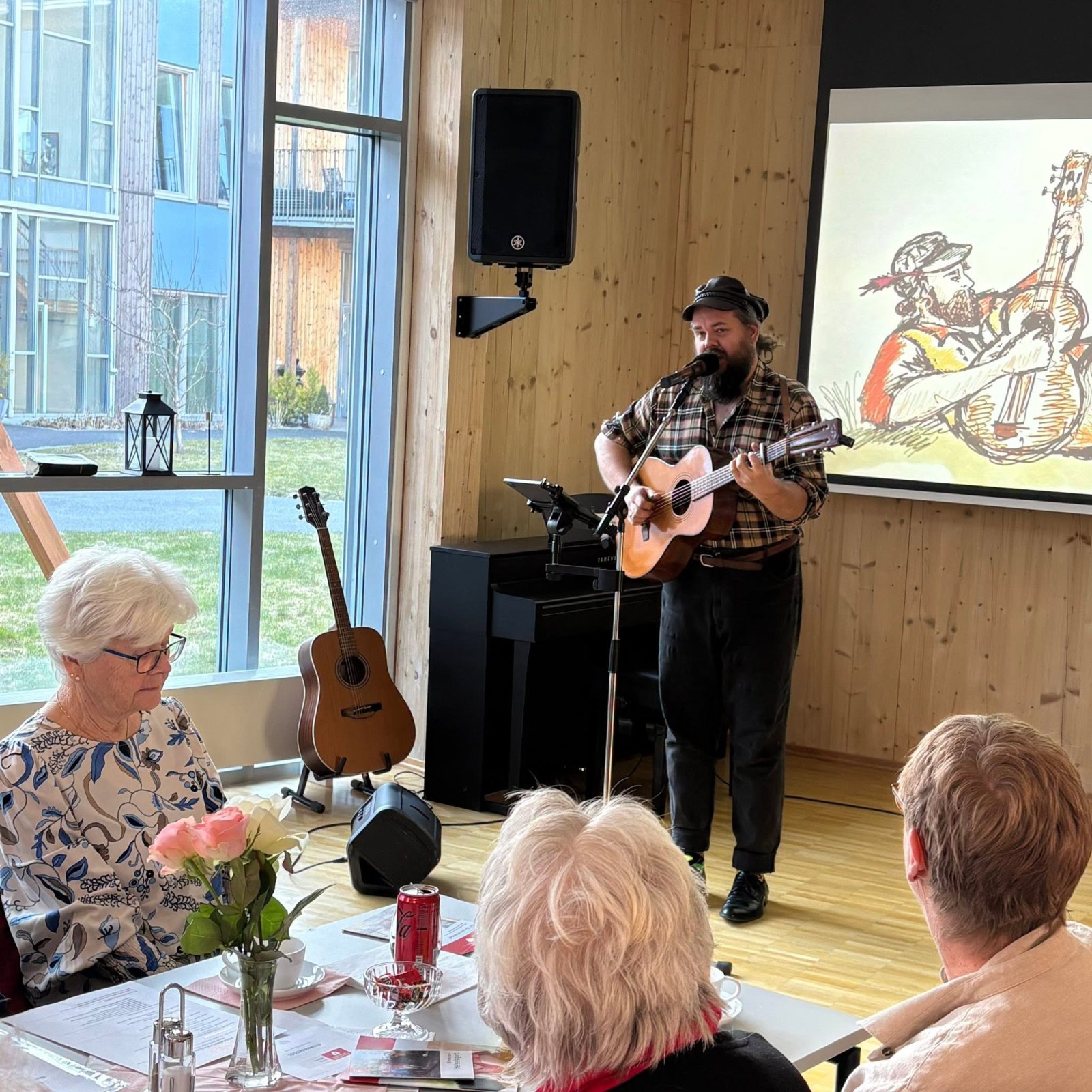 Visesanger Daniel Sandvik spiller gitar